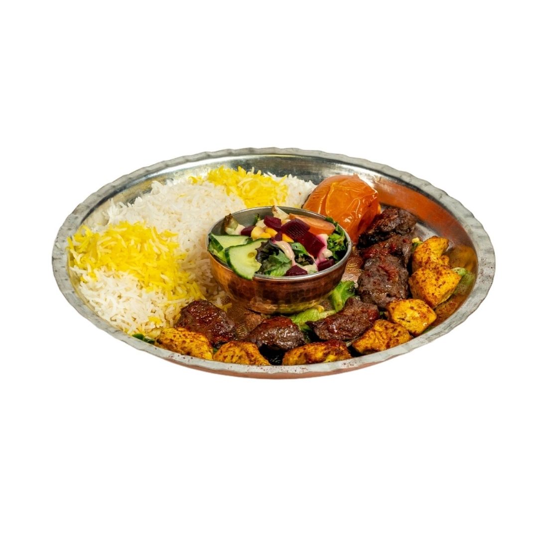 Momtaz Rumi, a platter featuring skewers of Joojeh (chicken) and Chenjeh (beef), served with saffron rice, grilled vegetables, and fresh salad at Rumi Restaurant Auckland.